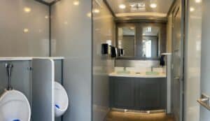 8Stall Gray Millennium Mens room interior